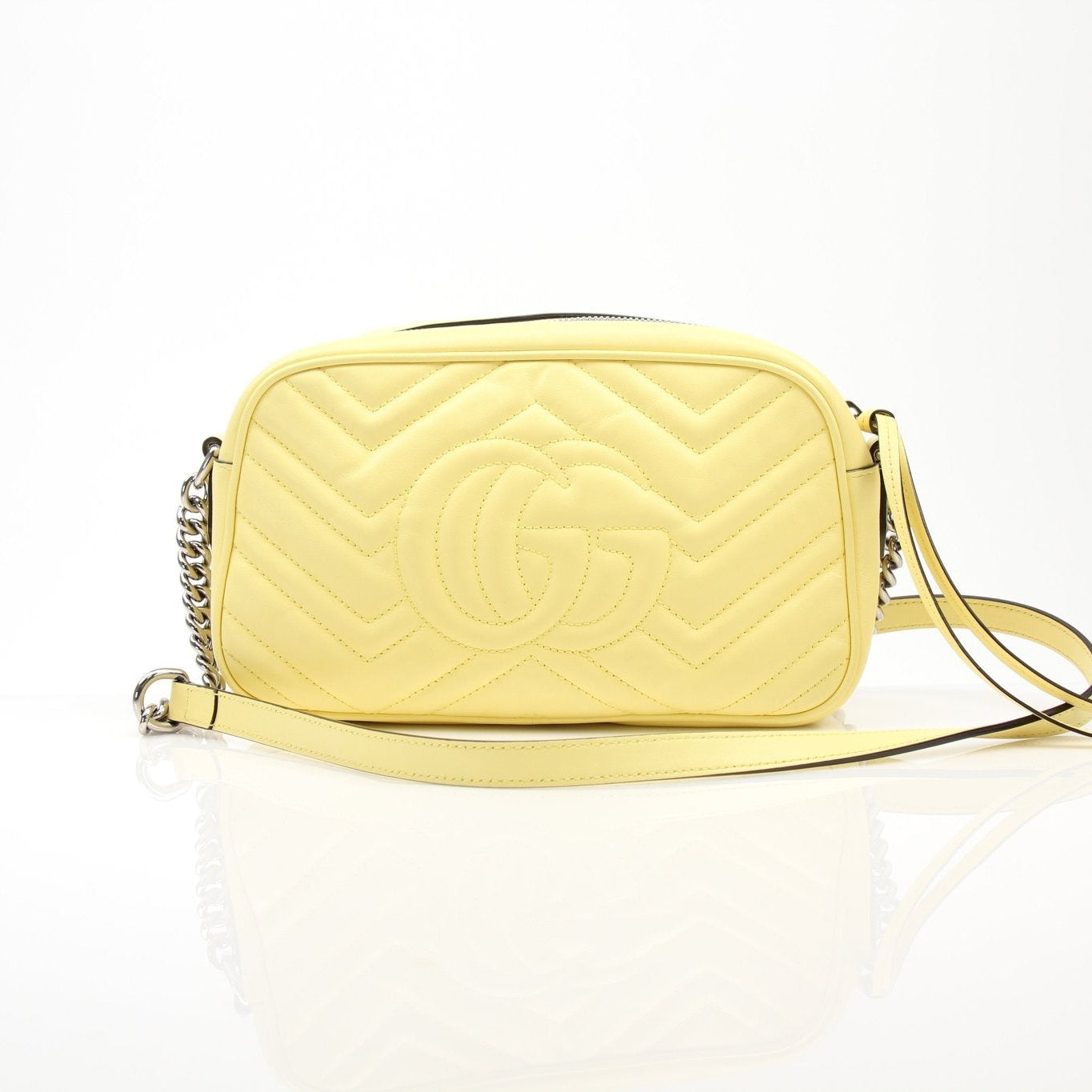 Gold & Beyond Gucci GG Marmont shoulder handbag with quilted leather and chain strap, showcasing elegant design and gold-tone hardware.