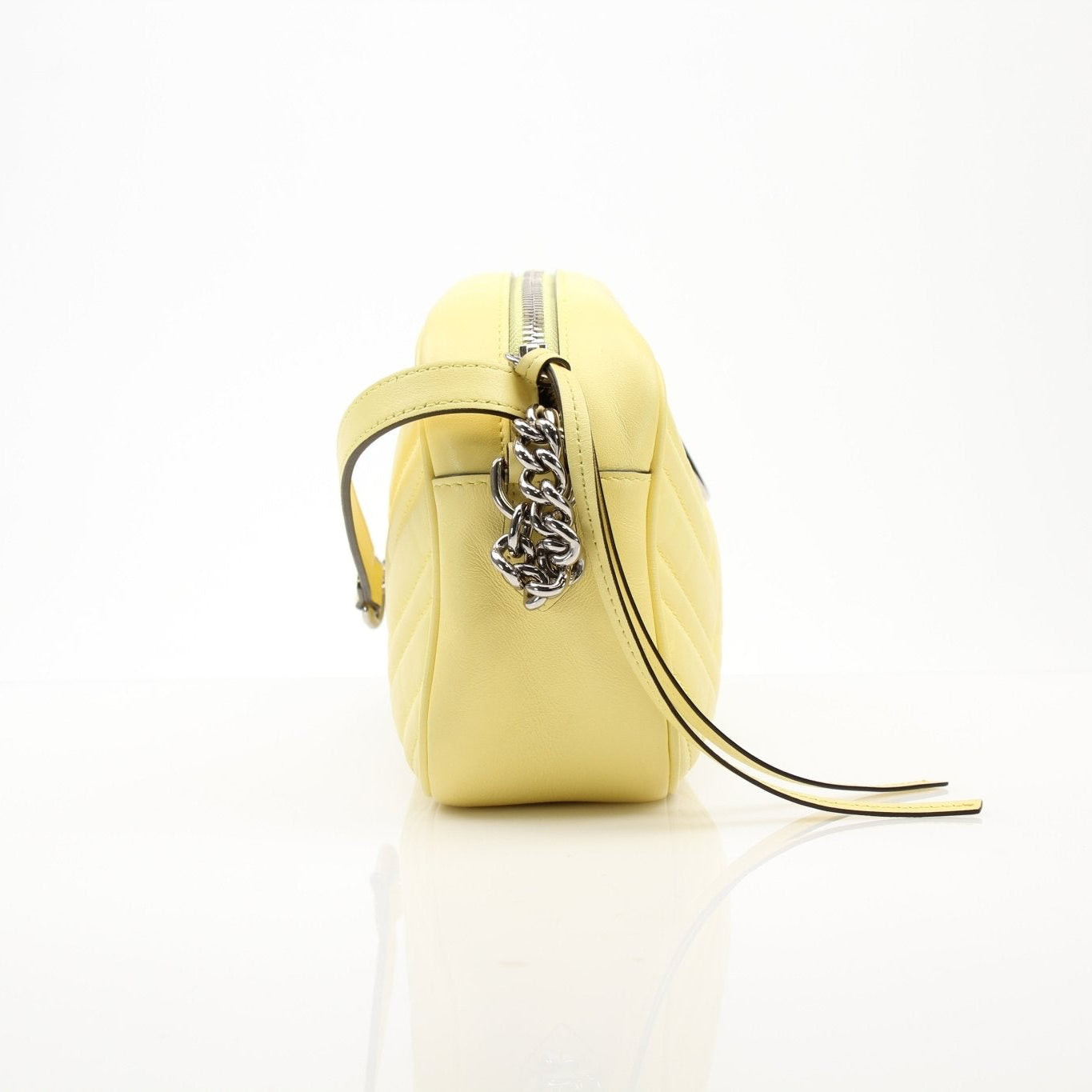 Luxury Gucci GG Marmont shoulder handbag with quilted leather and gold hardware, stylishly displayed on a neutral background.
