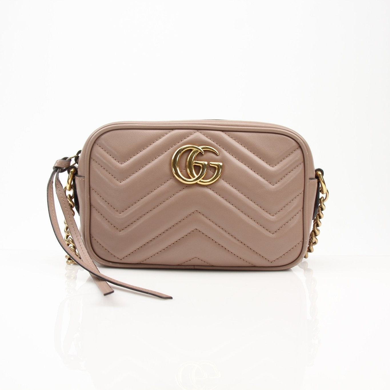 Gucci Mini GG Marmont Mini Camera Bag handbag with quilted leather and chain strap, stylish accessory for women.