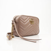 Gucci Mini GG Marmont mini camera handbag with chain strap and quilted leather, stylish accessory for everyday or evening.