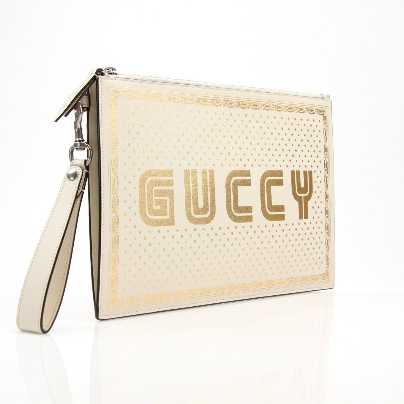 Cream leather Gucci Moon and Stars zip-around pouch with celestial print, featuring gold accents and compact handbag design.