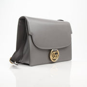 Gold & Beyond Gucci GG Marmont shoulder handbag with quilted leather and chain strap, showcasing stylish designer detail.