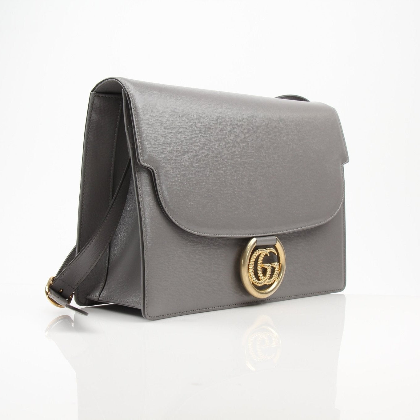 Gold & Beyond Gucci GG Marmont shoulder handbag with quilted leather and chain strap, showcasing stylish designer detail.