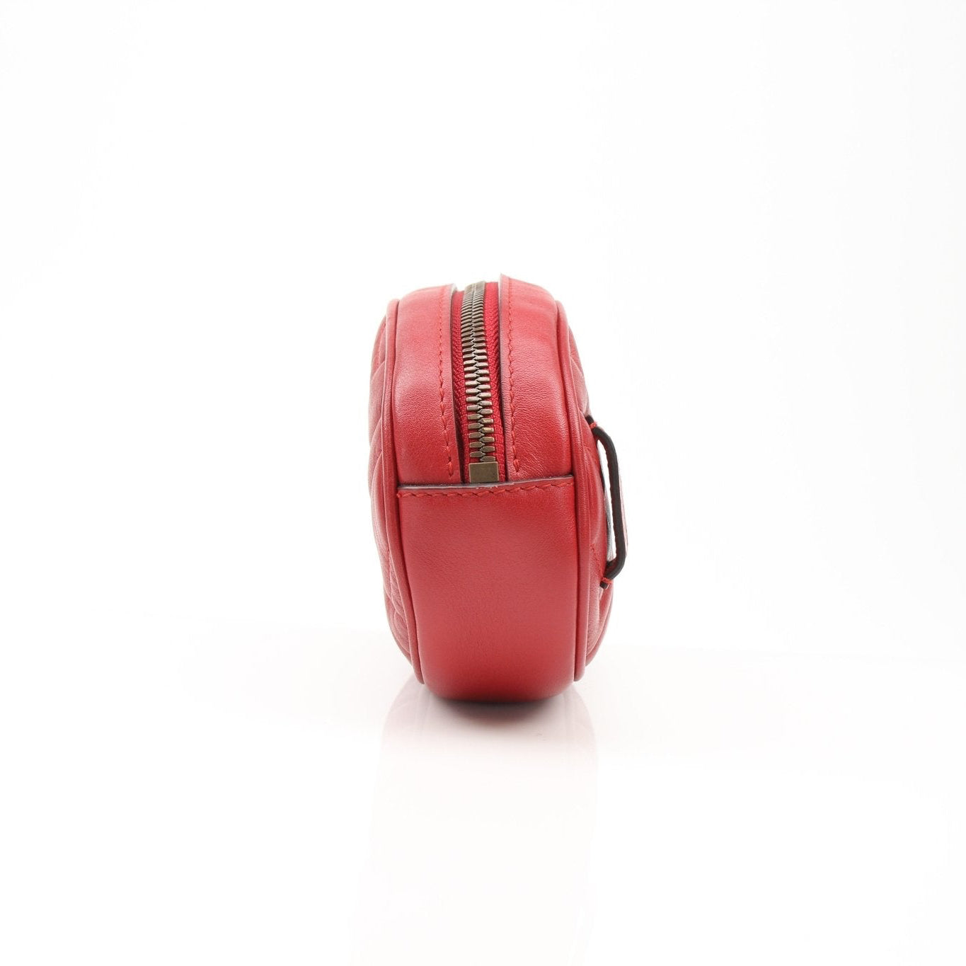 Gucci GG Marmont belt bag with quilted leather and gold hardware, featuring a chain strap and signature GG logo.