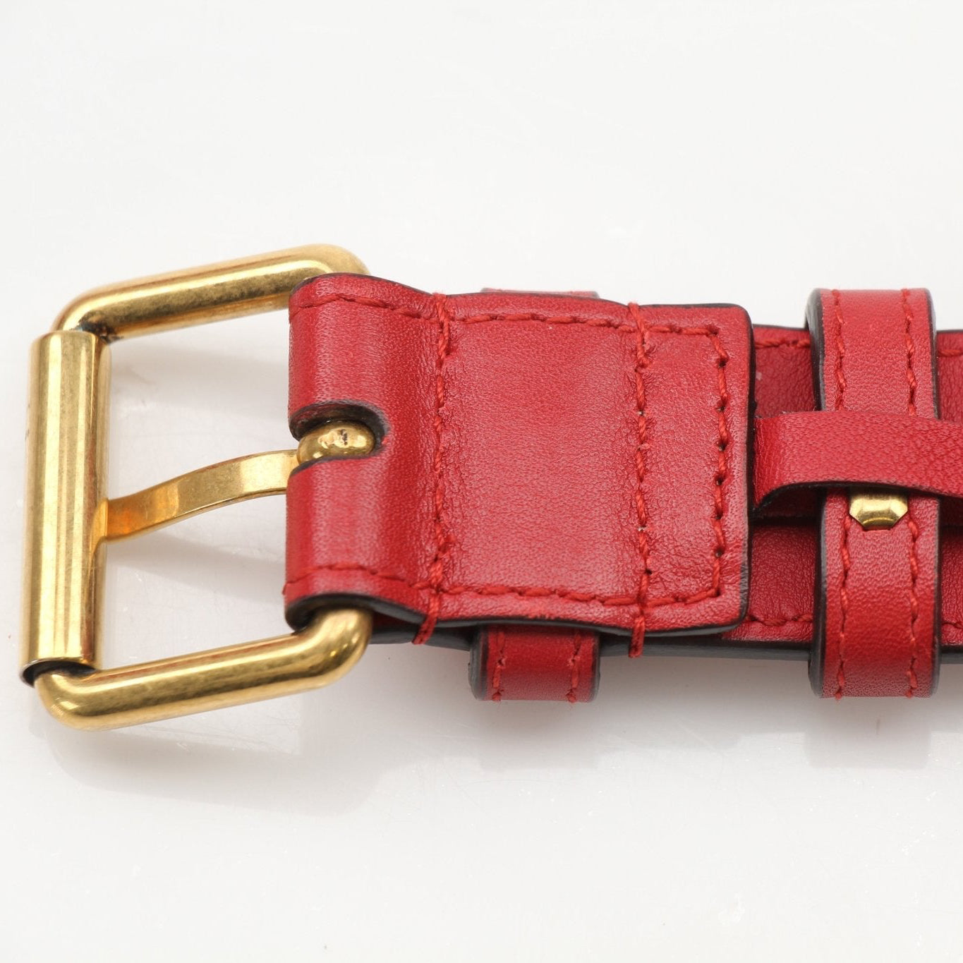 Gucci GG Marmont belt bag in black leather with gold hardware, featuring chevron quilted design and adjustable strap.