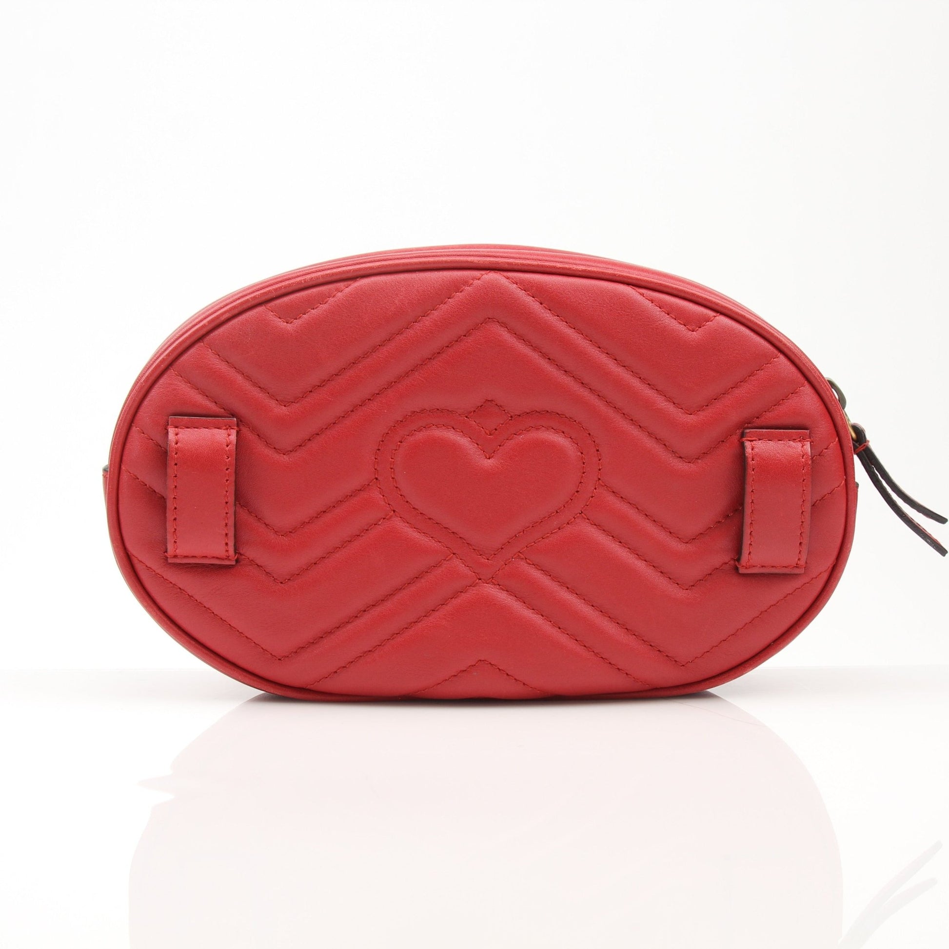 Gold & Beyond Gucci GG Marmont belt bag handbag with quilted leather and gold hardware, displayed on a neutral background.