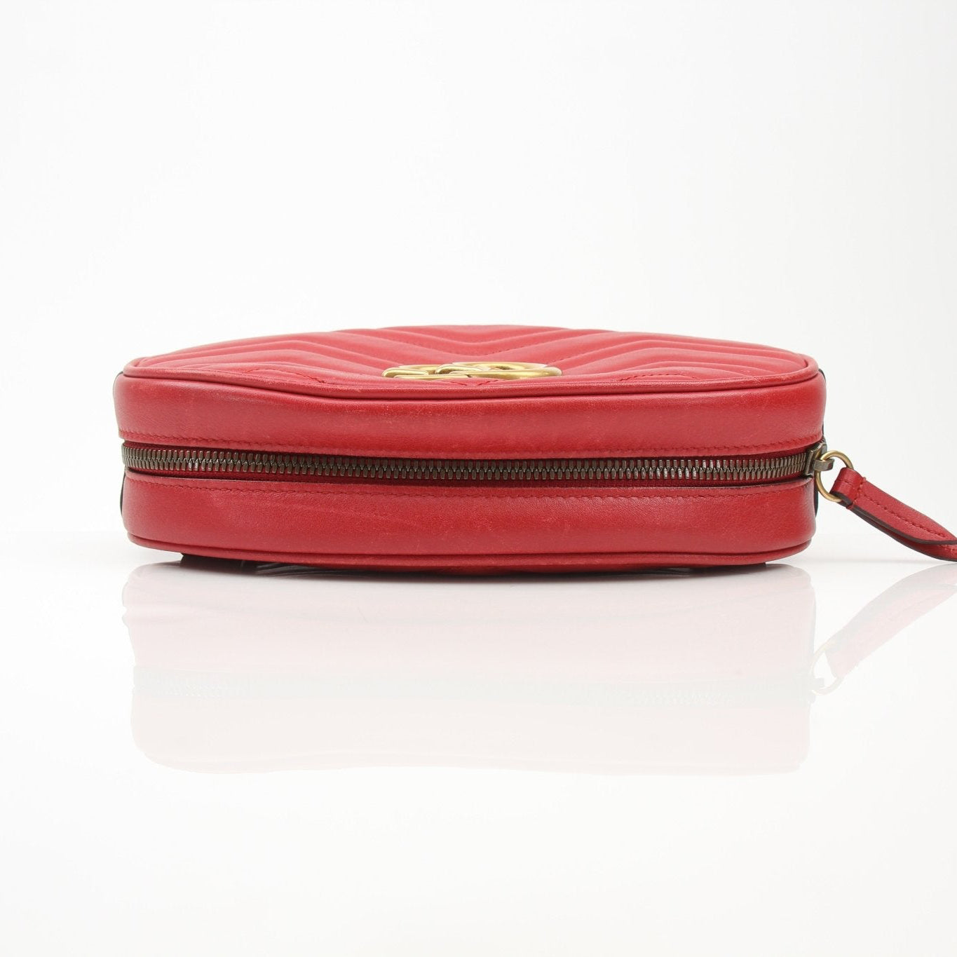Gold & Beyond Gucci GG Marmont belt bag handbag with quilted leather and gold hardware, featuring the brand's signature chevron pattern.