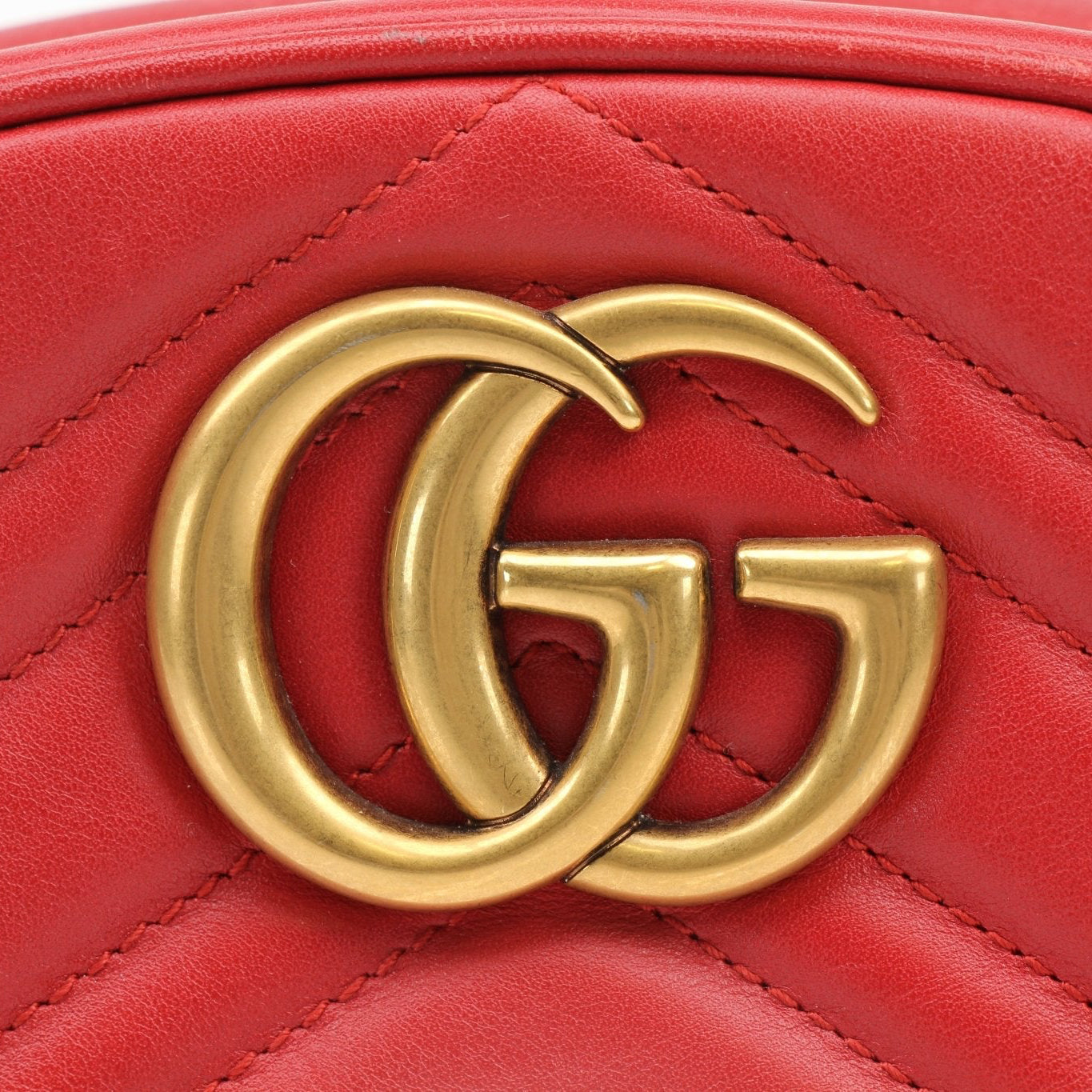 Gold & Beyond Gucci GG Marmont belt bag handbag with quilted leather and gold hardware showing front view.