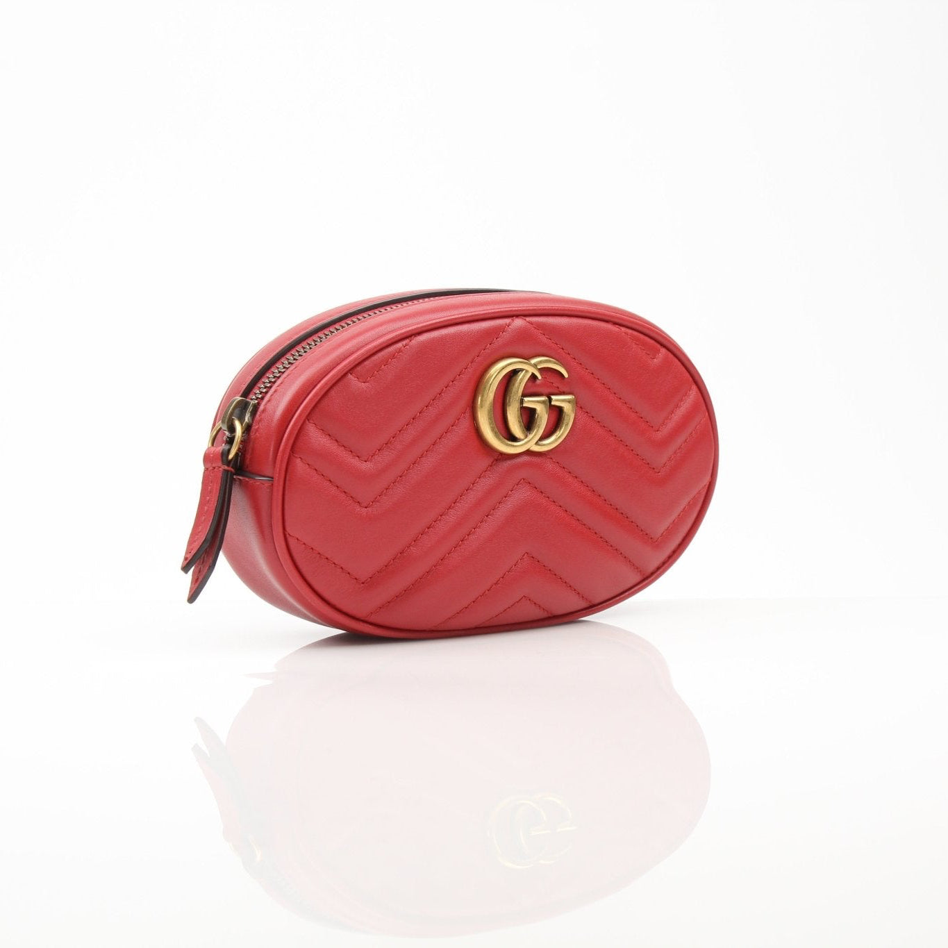 Gold & Beyond Gucci Marmont Matelassé GG belt bag, stylish handbag with quilted design and gold hardware on a neutral background.