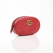 Gold & Beyond Gucci Marmont Matelassé GG belt bag, stylish handbag with quilted design and gold hardware on a neutral background.