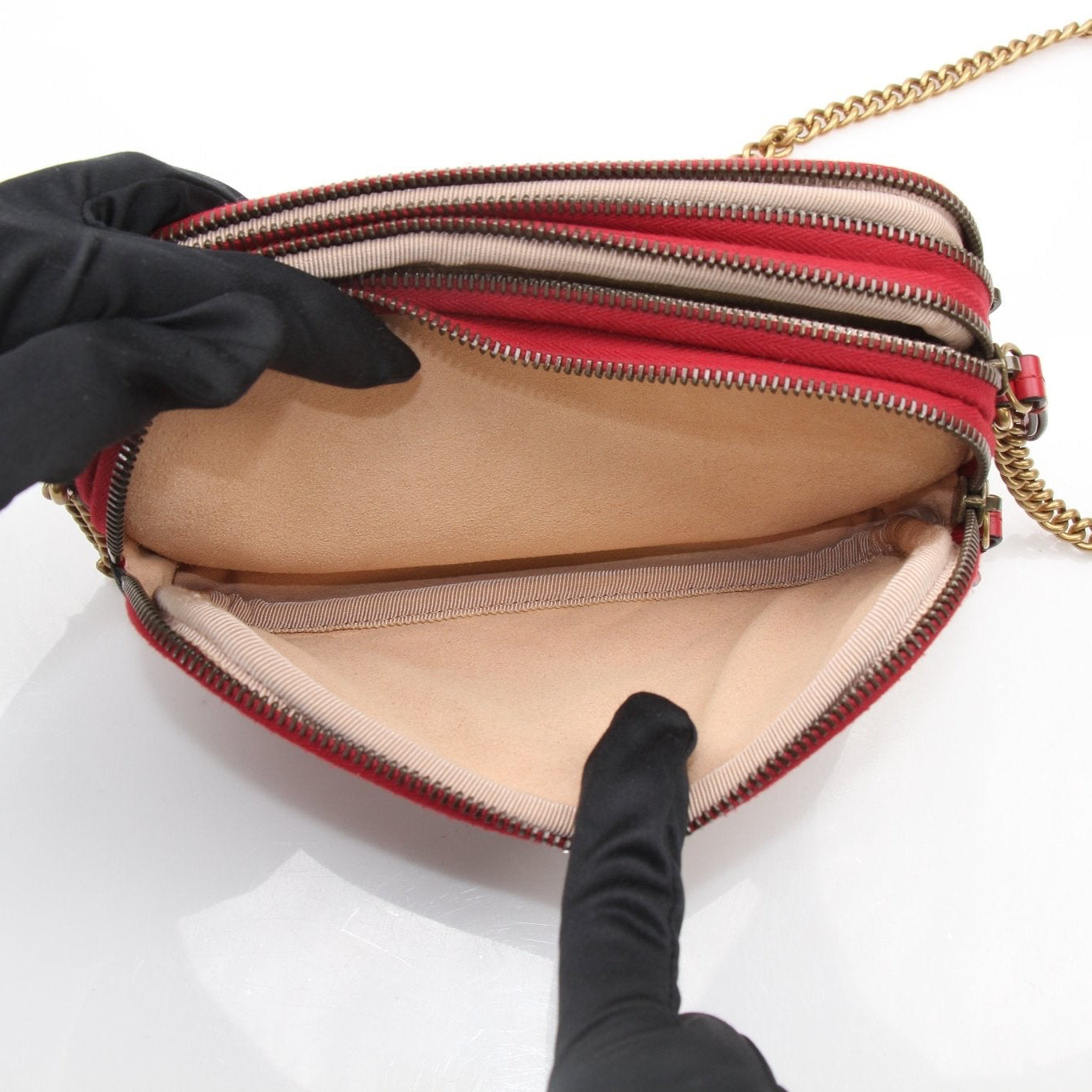 Gucci GG Marmont Matelassé Mini Shoulder Bag in black leather with gold hardware, featuring chevron quilting and chain strap.