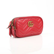Gold & Beyond Gucci GG Marmont Mini Shoulder Bag, black matelassé leather handbag with gold hardware and chevron stitching.
