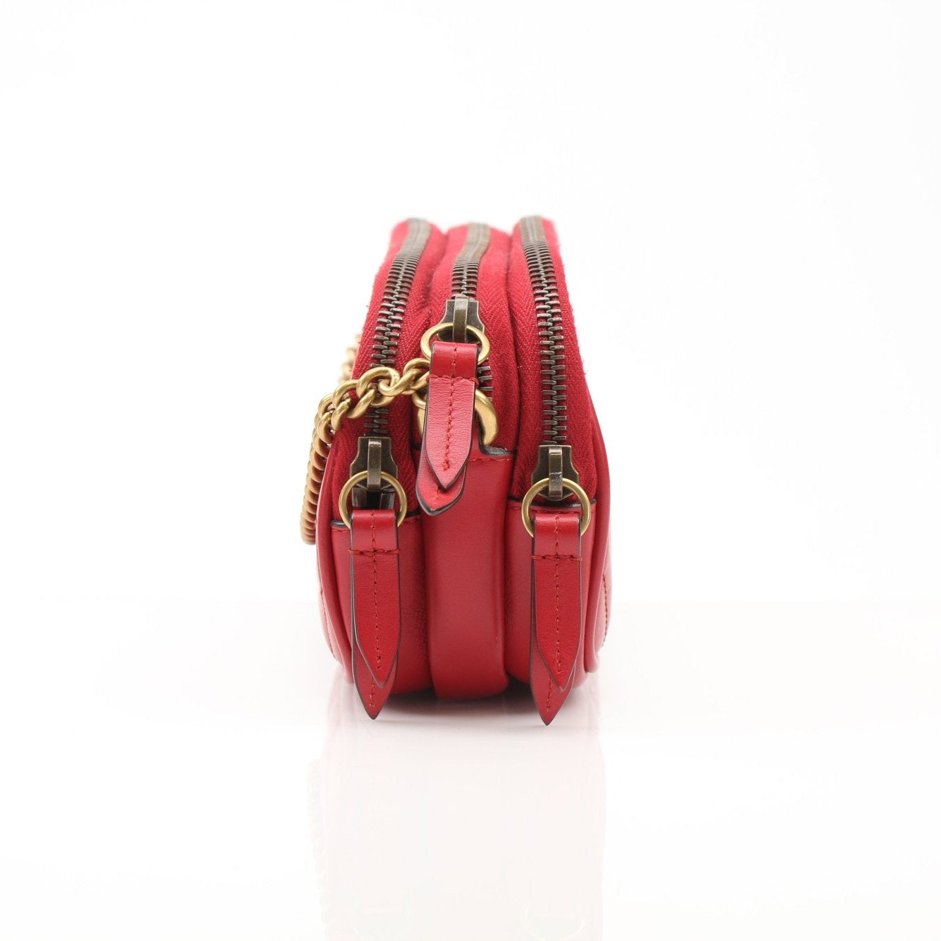 Gold & Beyond Gucci GG Marmont Matelassé Mini Shoulder Bag handbag with chevron quilted leather and gold-toned hardware.