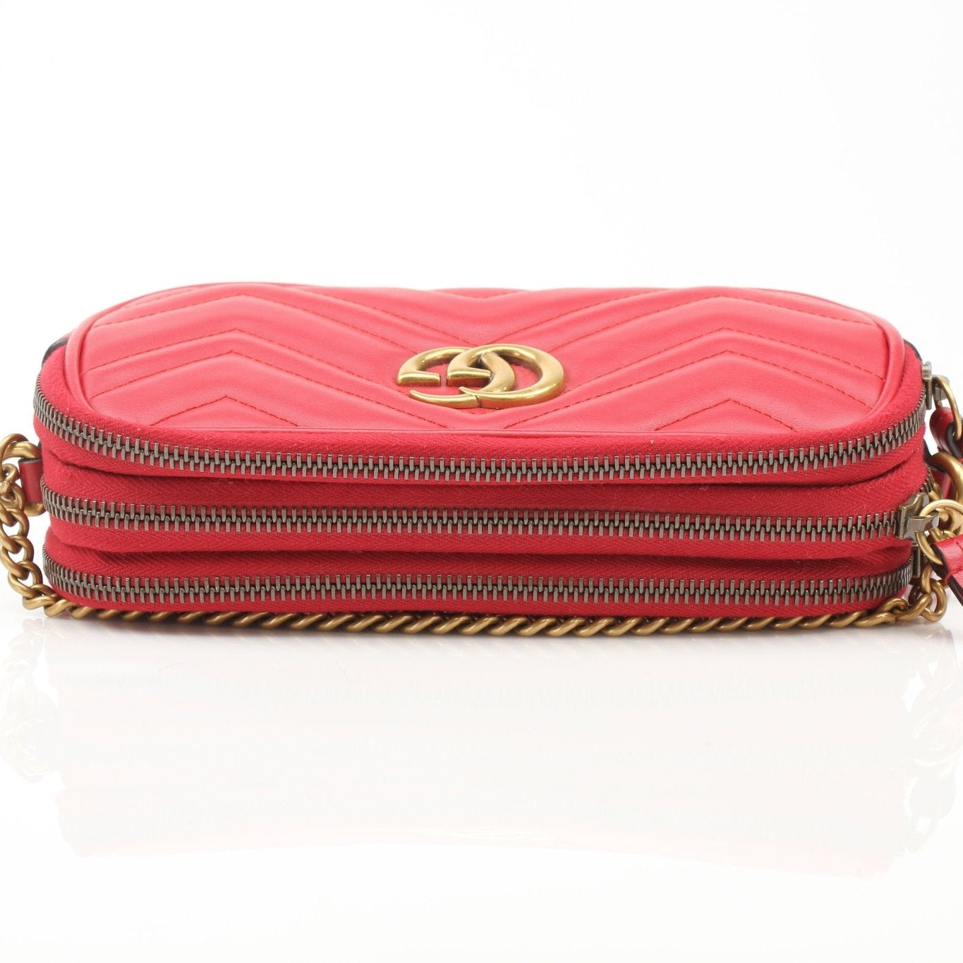 Gucci GG Marmont Matelassé Mini Shoulder Bag in black leather, featuring gold hardware and quilted design, by Gold & Beyond.