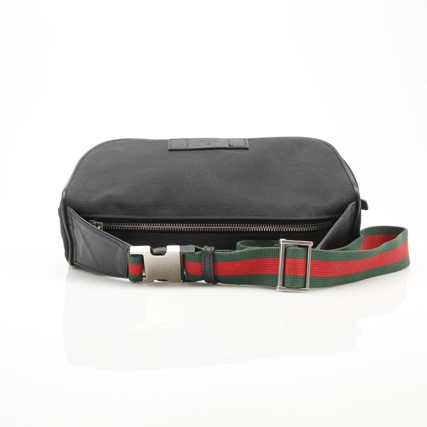 Gucci Techno Web Canvas waist bag with adjustable strap, front zipper pocket, and gold-tone details.