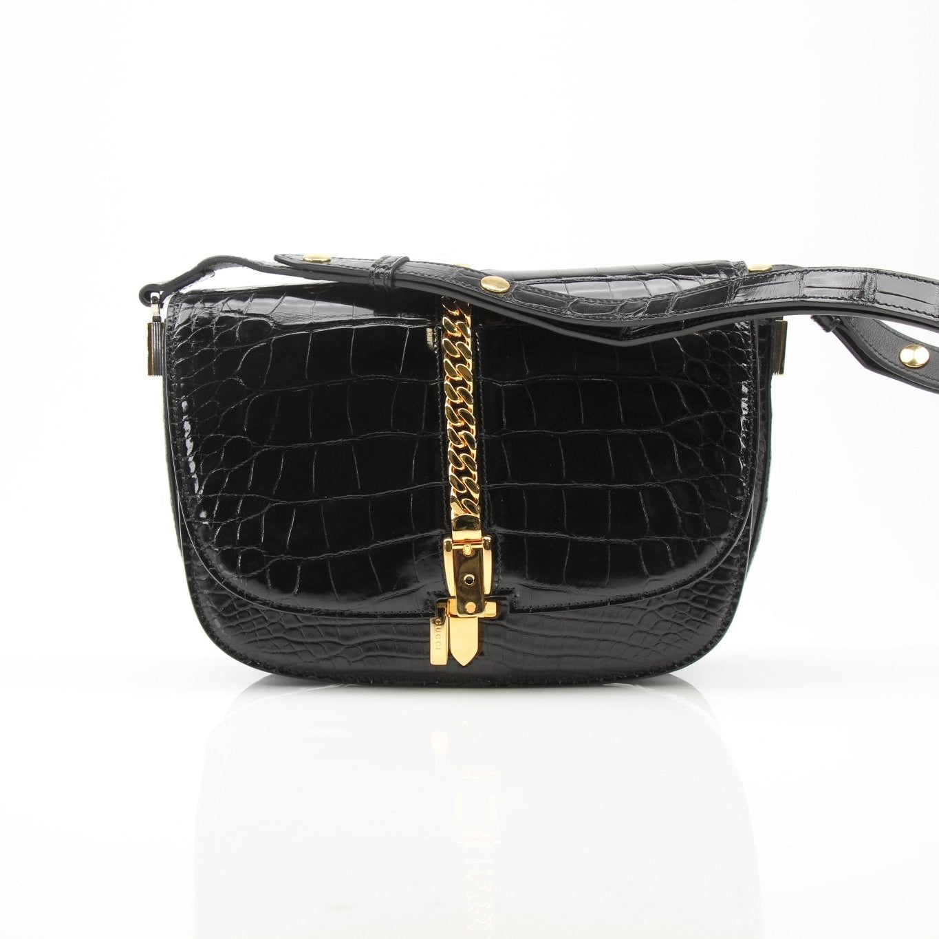Black crocodile leather Gucci Sylvie shoulder handbag with gold hardware, featuring a structured design and elegant strap.