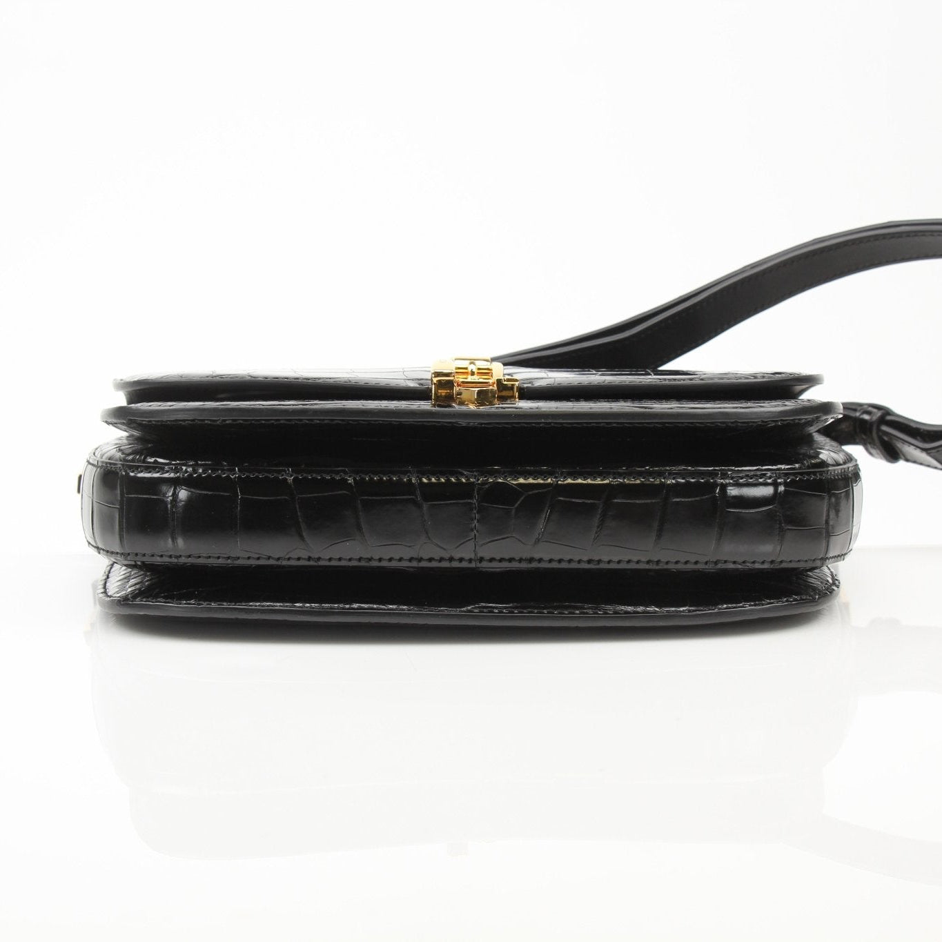Gucci black crocodile Sylvie shoulder handbag with gold accents and sleek design, showcasing luxurious leather craftsmanship.