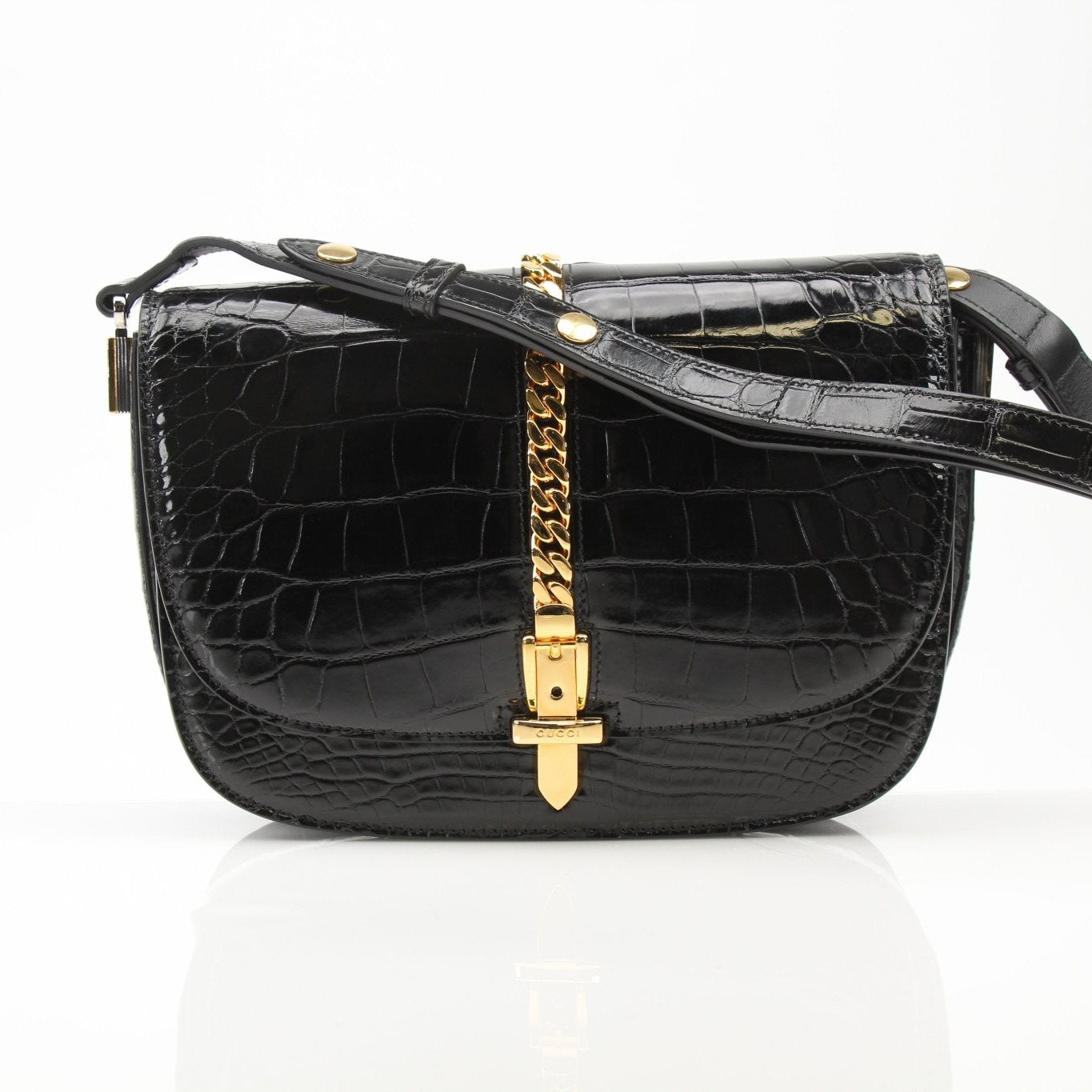 Black crocodile leather Gucci Sylvie shoulder handbag with gold-tone hardware and structured design.