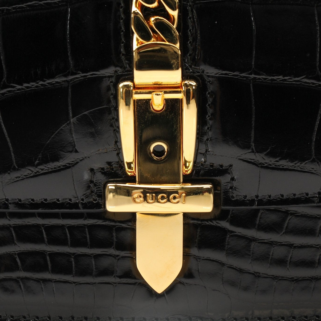 Black Gucci Crocodile Sylvie Shoulder Bag with gold hardware, featuring a sleek design and adjustable strap.