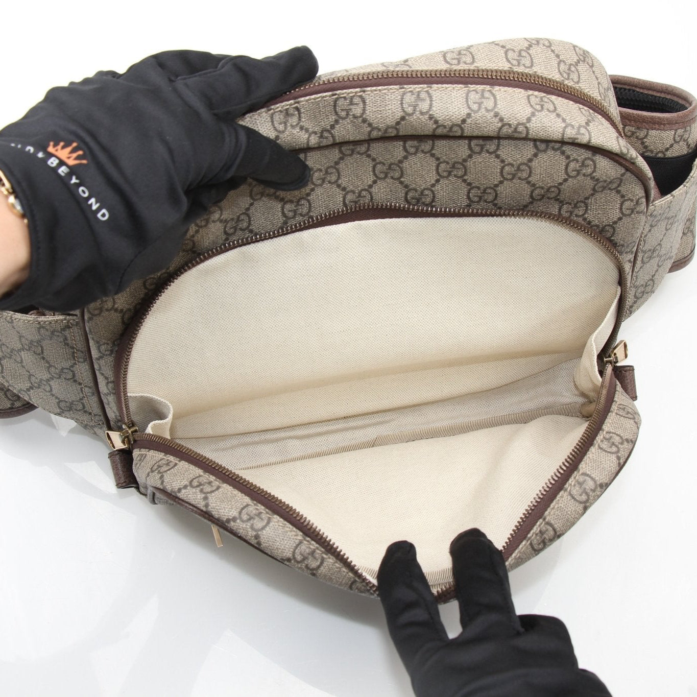 Gucci GG Ophidia belt bag with signature monogram pattern, gold-tone hardware, and adjustable strap, stylish handbag accessory.