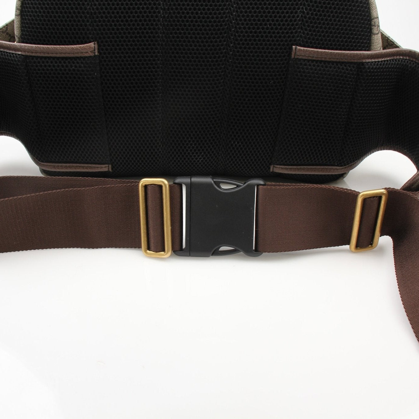 Gucci GG Ophidia belt bag, stylish handbag with signature monogram canvas and leather accents, on a neutral background.