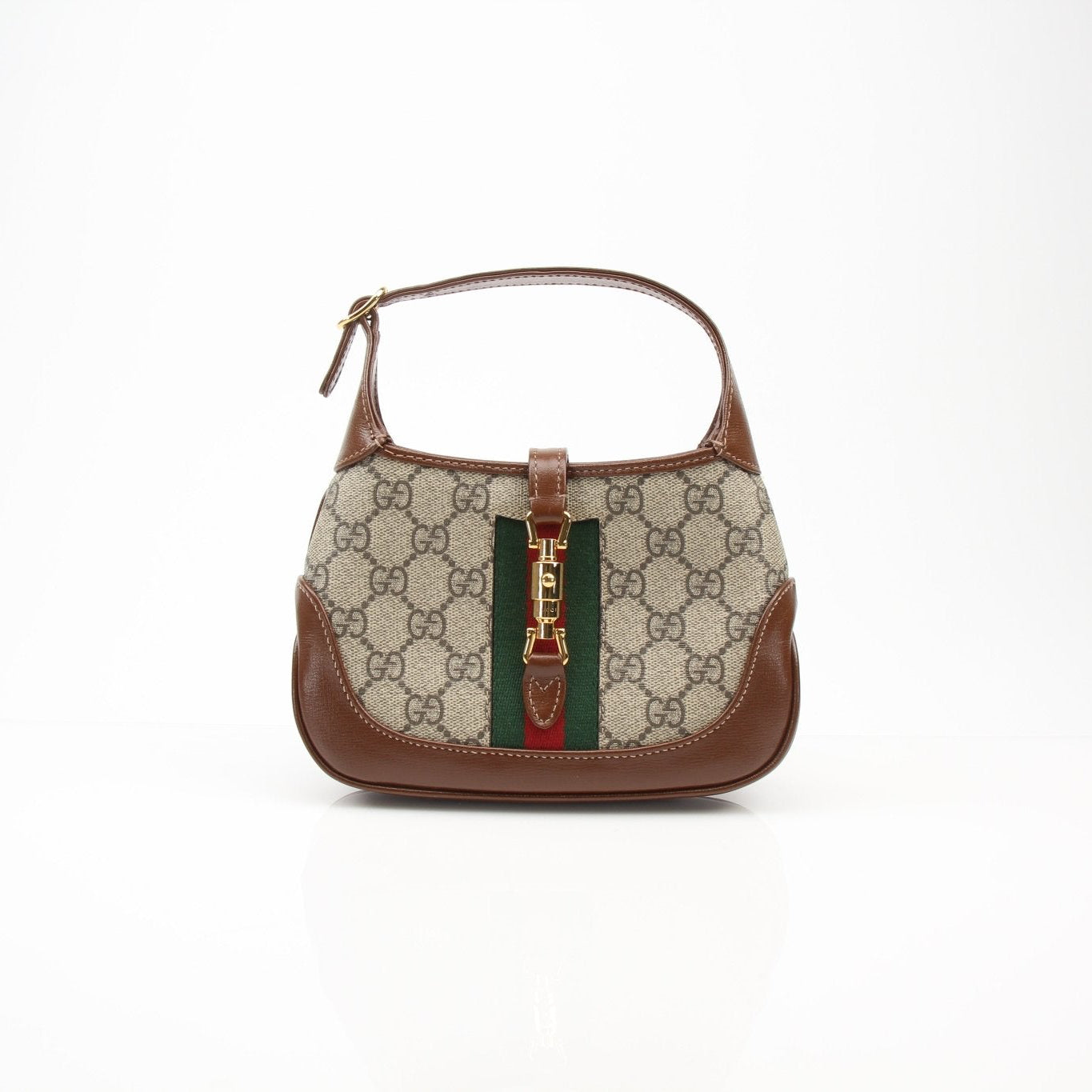 Gucci 1961 Mini Jackie GG shoulder handbag in beige and brown leather with gold hardware, stylish and compact design.