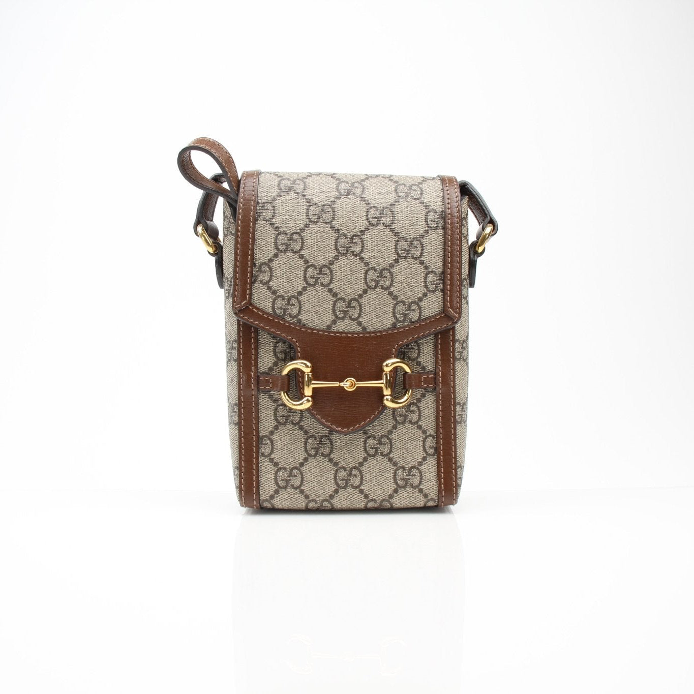 Gucci GG Supreme Horsebit Mini Crossbody Purse handbag with gold hardware and adjustable strap, featuring signature monogram pattern.