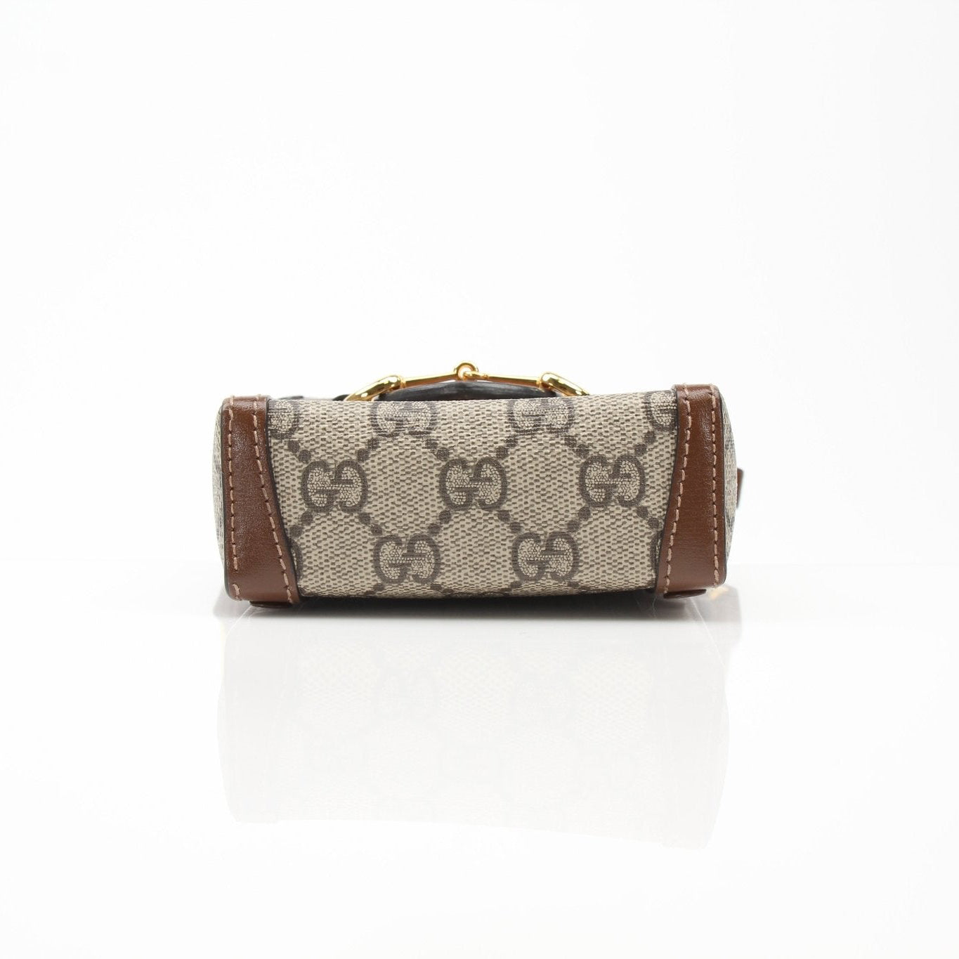 Gucci GG Supreme Horsebit Mini Crossbody Purse handbag with gold hardware and adjustable strap, featuring iconic pattern and compact design.