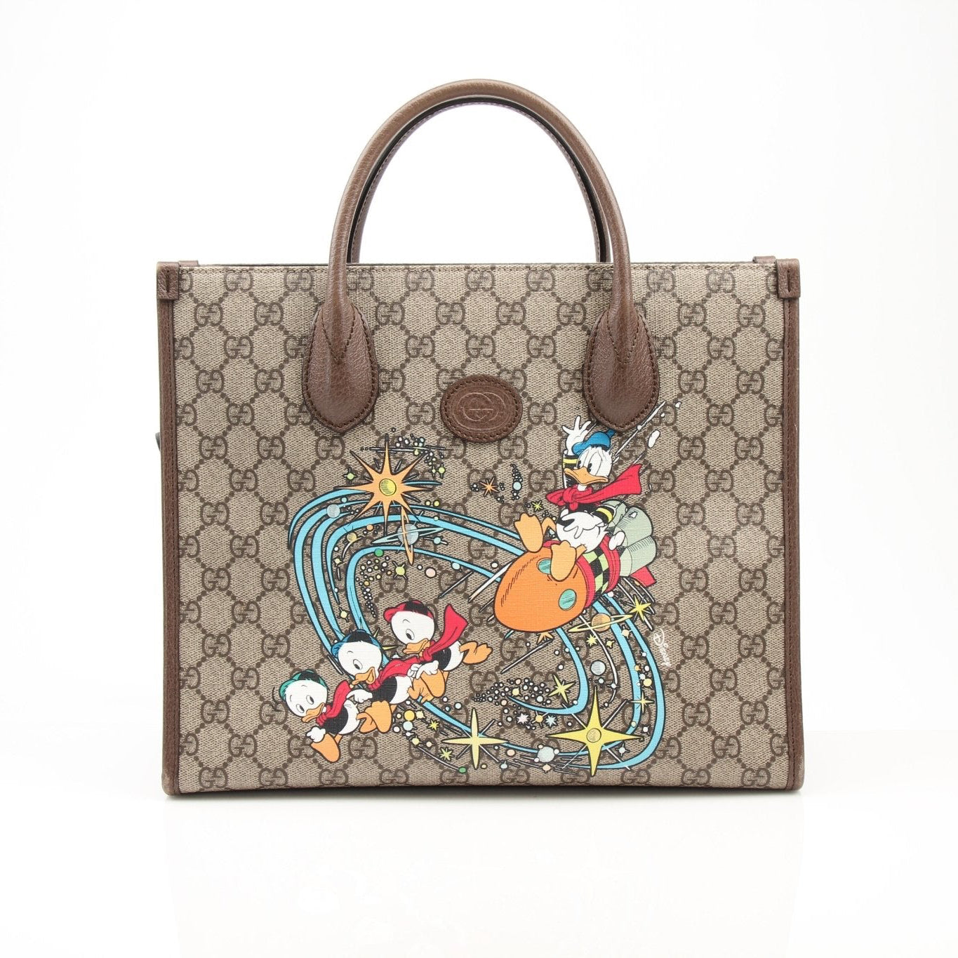 Gucci Disney Duck tote handbag by Gold & Beyond, featuring a playful duck design and sturdy handles for everyday use.
