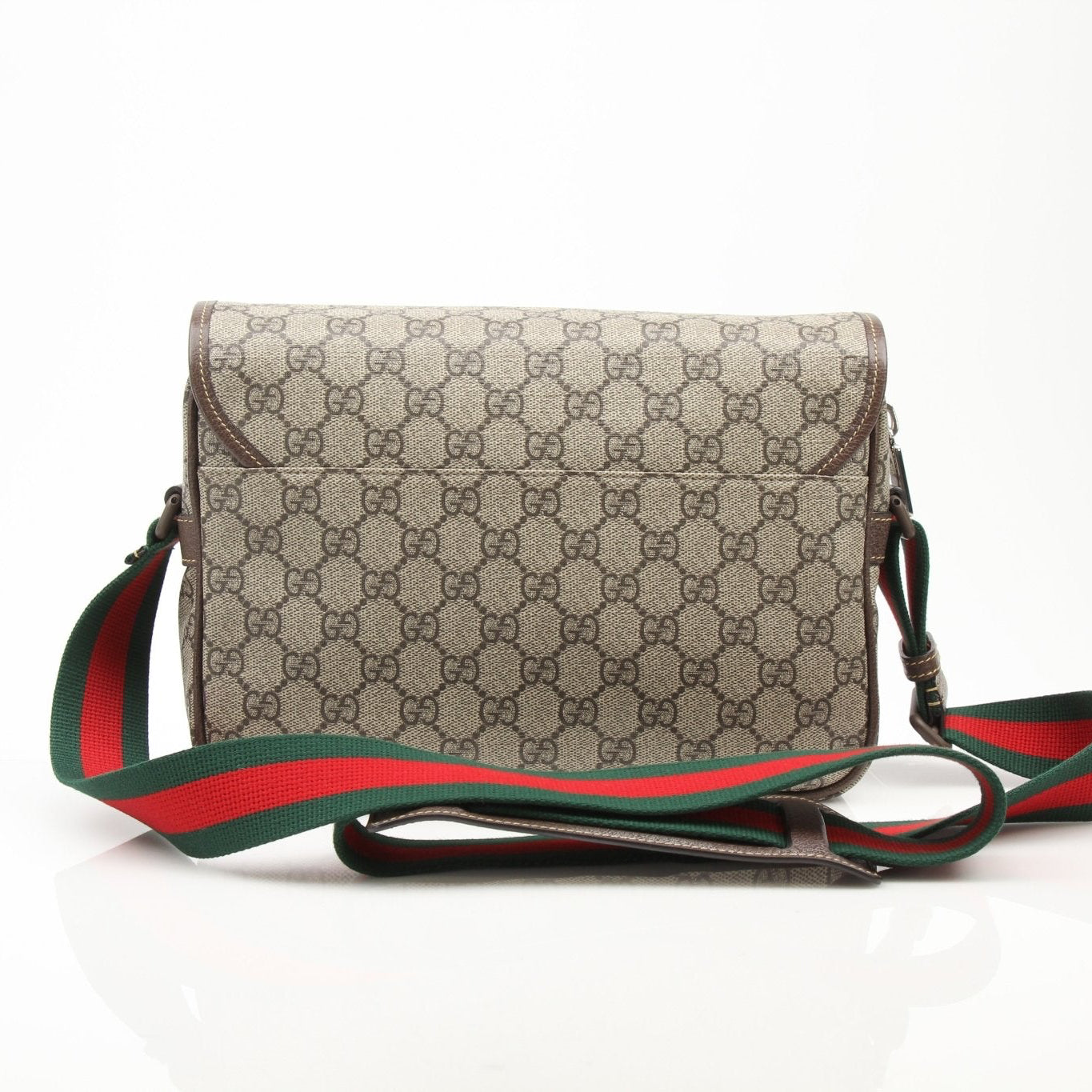 Gucci GG Supreme messenger handbag with leather strap and gold-tone hardware, stylish and versatile for everyday use.