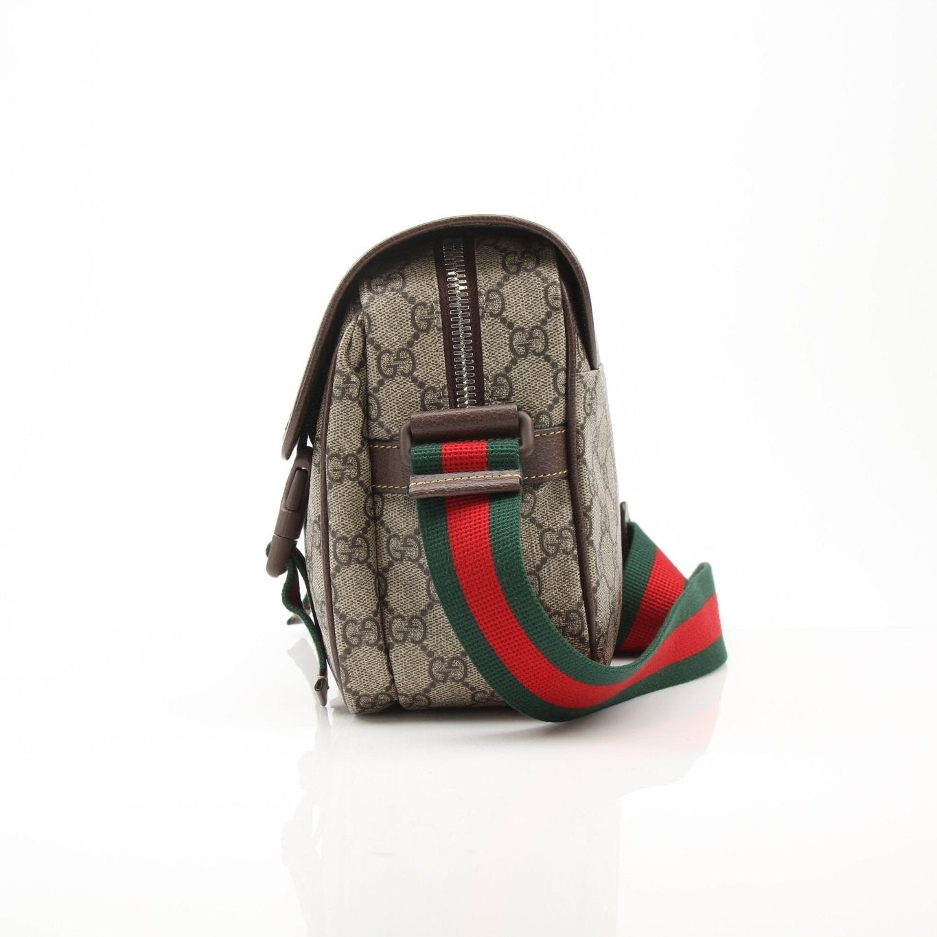 Gold & Beyond Gucci GG Supreme messenger handbag with adjustable strap and signature monogram pattern.