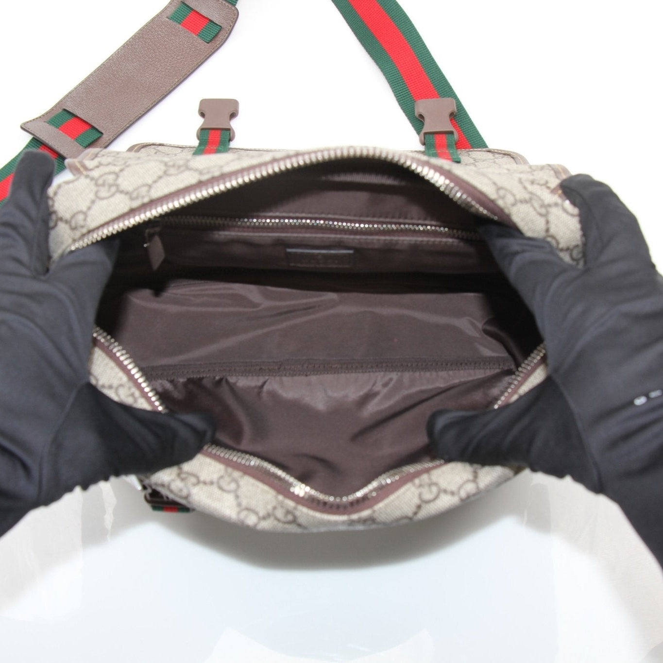 Gold & Beyond Gucci GG Supreme Messenger Bag handbag with beige and brown monogram canvas and leather accents.