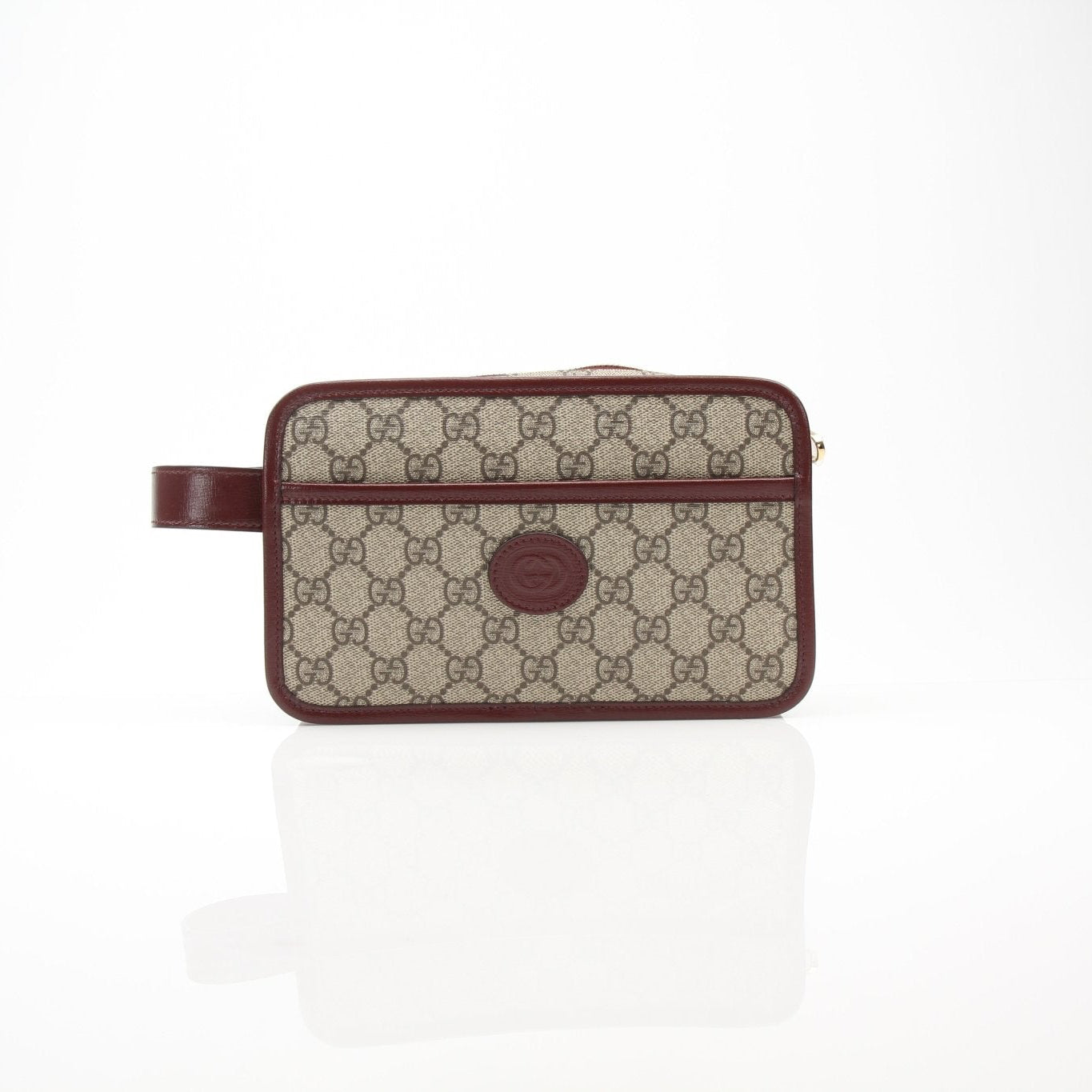 Gucci GG Supreme Dopp Kit pouch in travel bag style by Gold & Beyond, featuring signature monogram pattern and compact design.
