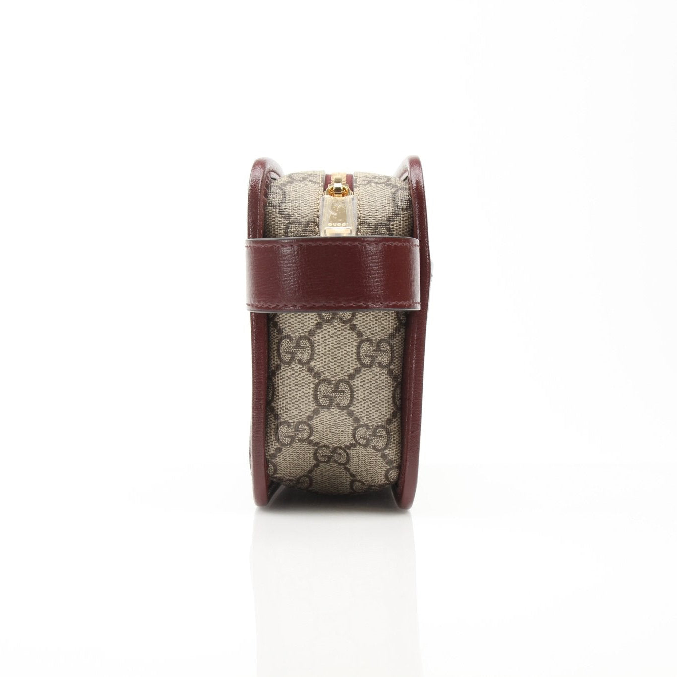 Gucci GG Supreme Dopp Kit pouch for travel, featuring signature monogram canvas and leather trim, compact and stylish.