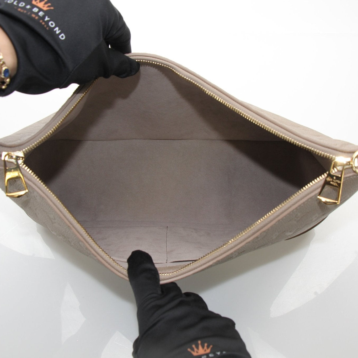 Gold & Beyond Louis Vuitton Boulogne GM shoulder handbag with brown leather and gold hardware, displayed on a neutral background.