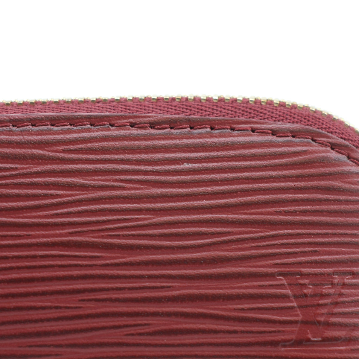 Louis Vuitton burgundy Epi cosmetic lipstick pouch by Gold & Beyond, featuring a compact textured leather design
