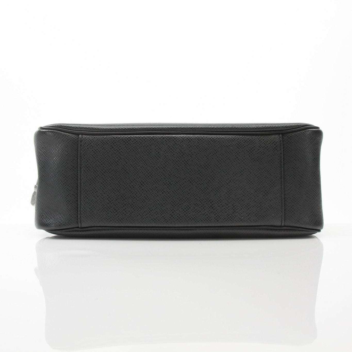 Louis Vuitton black zippered toiletry bag, vanity case with sleek design and gold accents, perfect for travel organization.