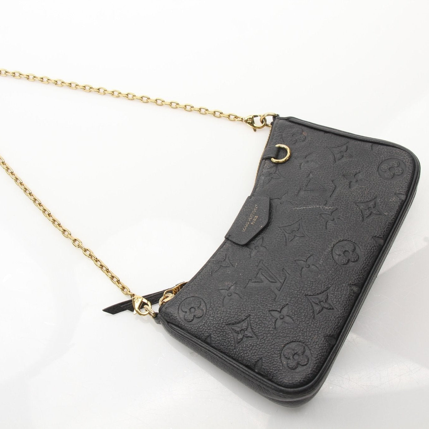 Louis Vuitton black Easy Pouch handbag with strap, featuring sleek design and gold accents, by Gold & Beyond.