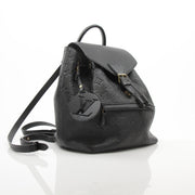 Gold & Beyond Louis Vuitton Mountsouris backpack, stylish travel bag with leather accents and spacious design, front view.