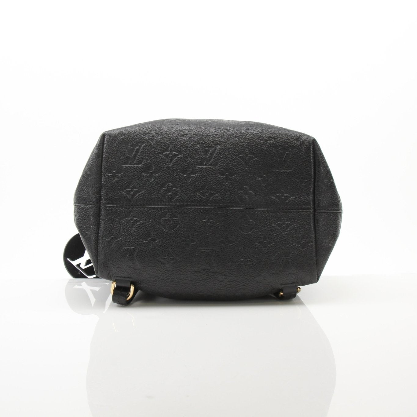 Gold & Beyond Louis Vuitton Mountsouris backpack, stylish travel bag with leather accents and spacious interior, ideal for travel and daily use.