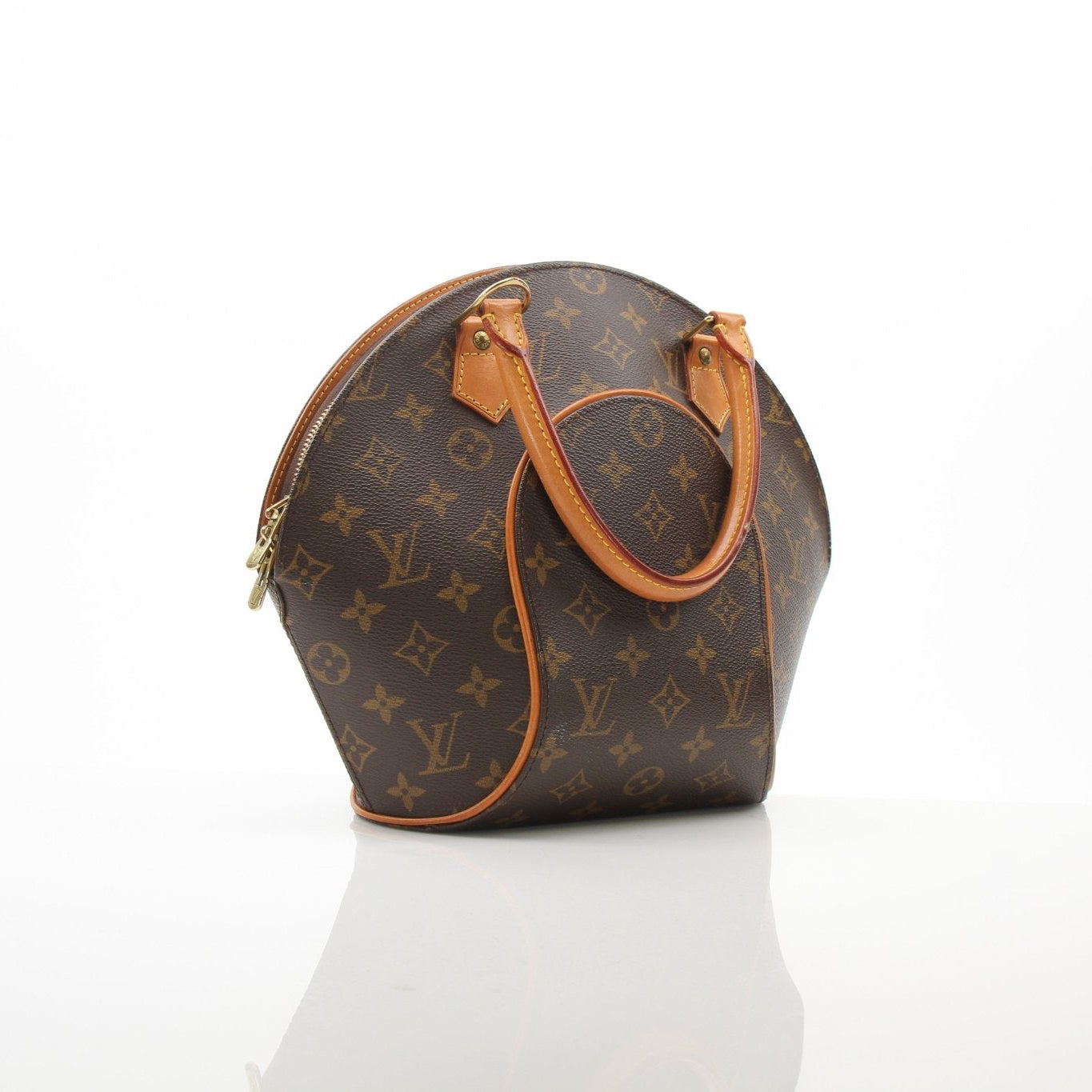 Louis Vuitton Ellipse PM top handle handbag with gold hardware and signature monogram canvas, carried by a model.