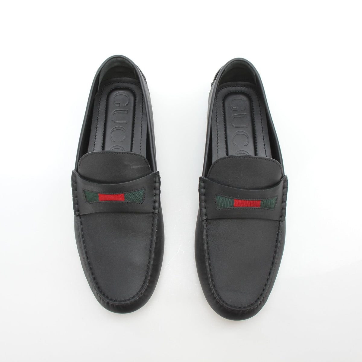 Gold & Beyond Gucci black leather driver loafers with signature web detail