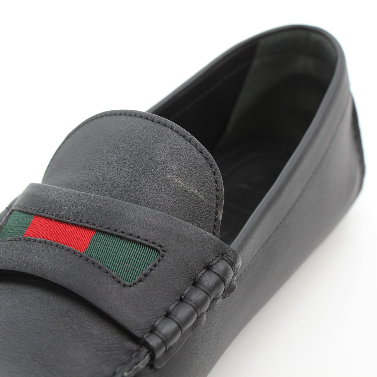 Gold & Beyond Gucci black leather driver loafers with Web detail