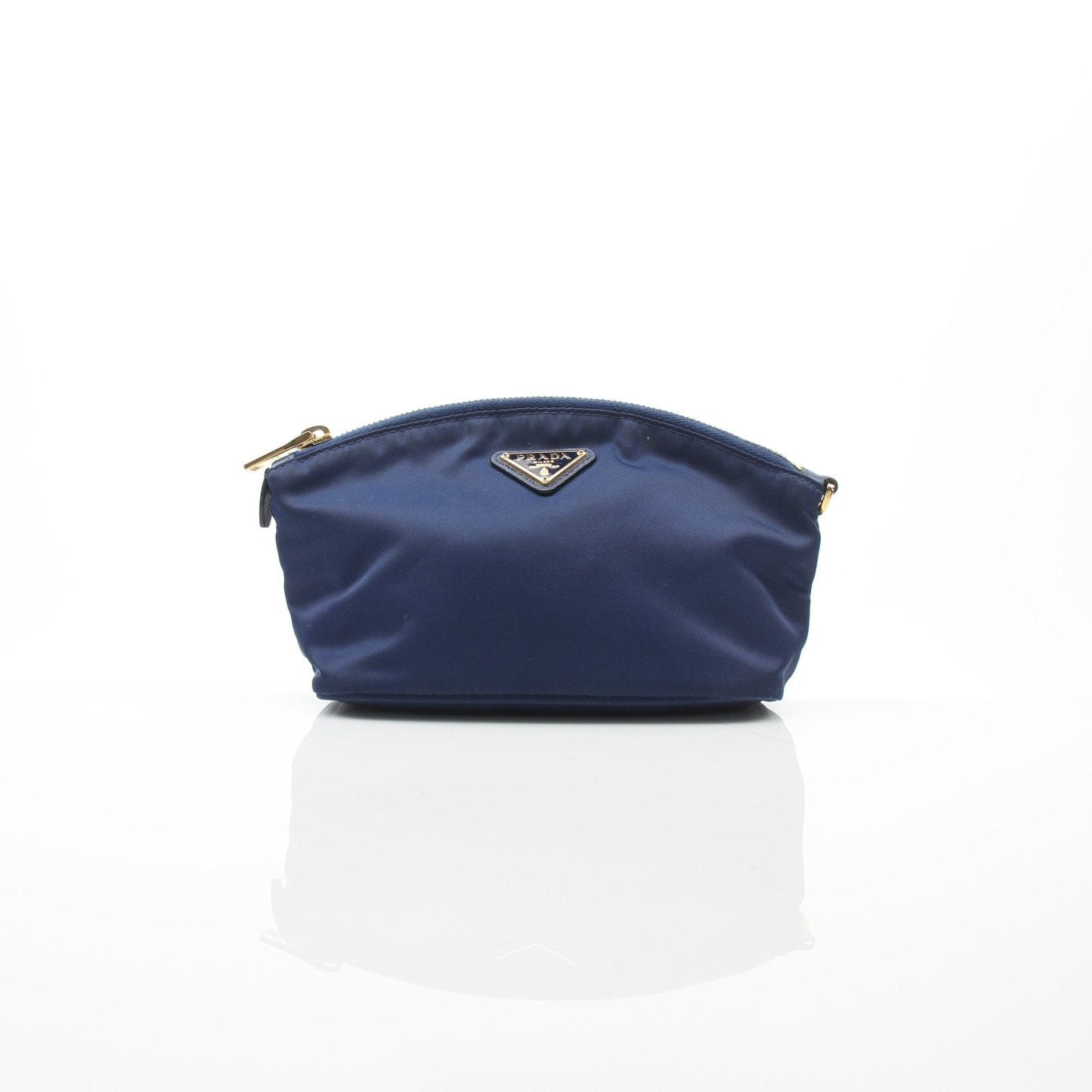 Prada navy blue Re-Nylon mini cosmetic pouch with gold accents, compact vanity case for cosmetics and essentials.