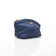 Prada navy blue Re-Nylon cosmetic mini pouch vanity case with zipper and compact design.