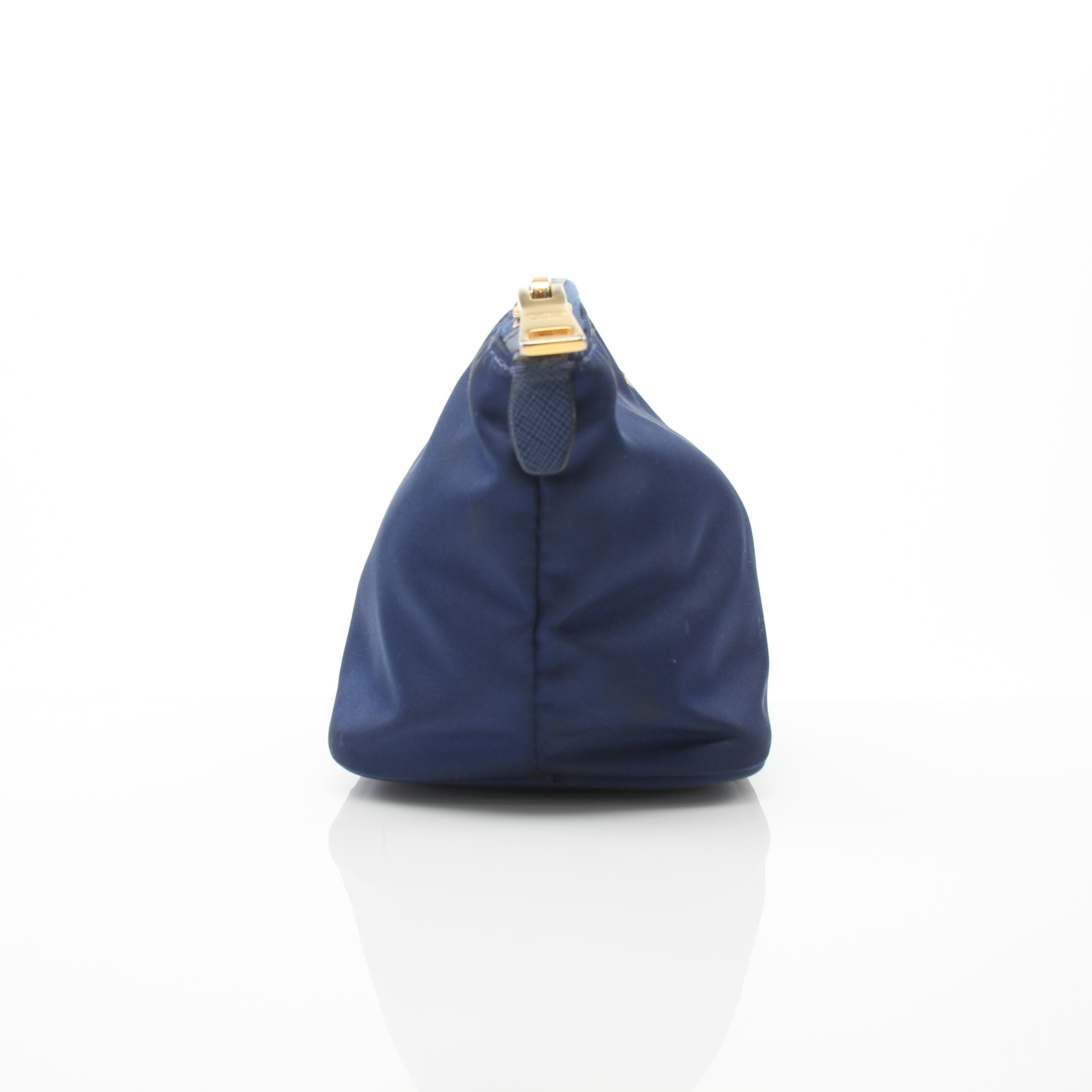 Prada navy blue Re-Nylon cosmetic mini pouch vanity case with gold accents, compact and stylish for travel and organization.