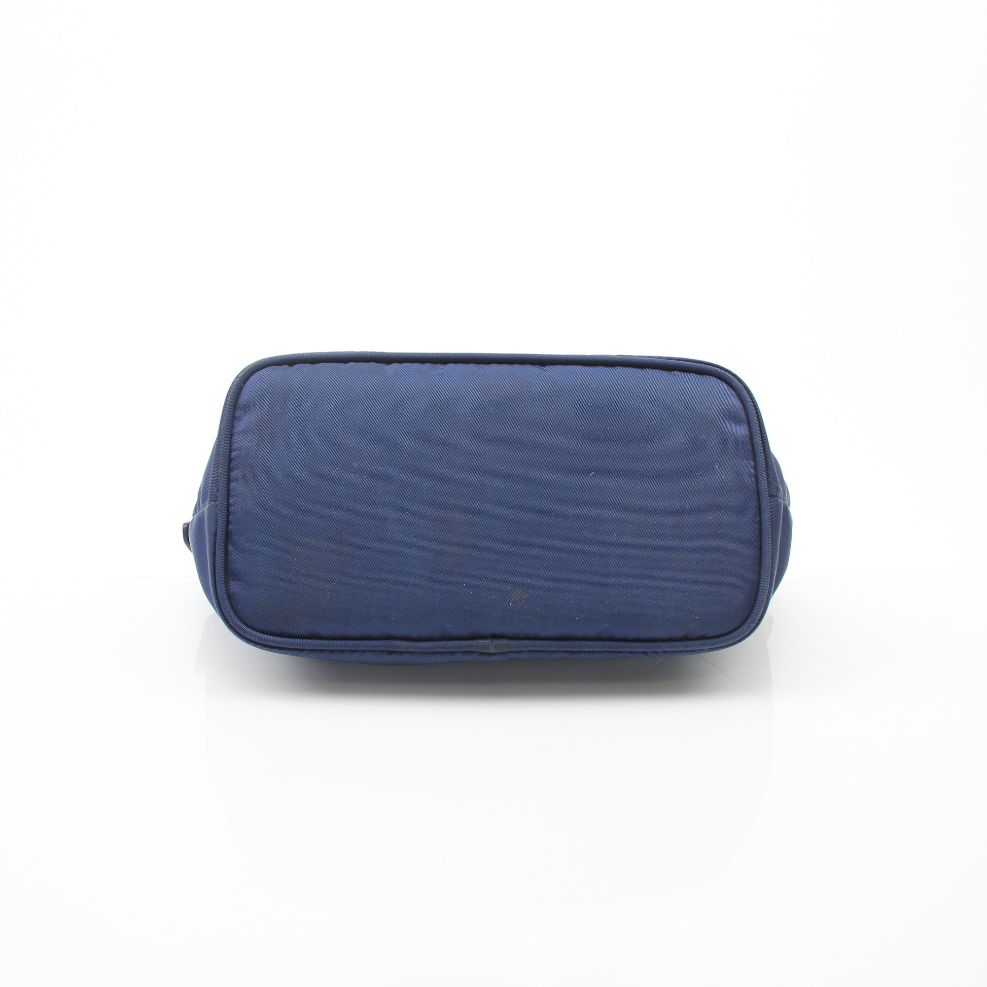 Prada navy blue Re-Nylon cosmetic mini pouch vanity case with gold accents, compact and stylish for travel and organization.