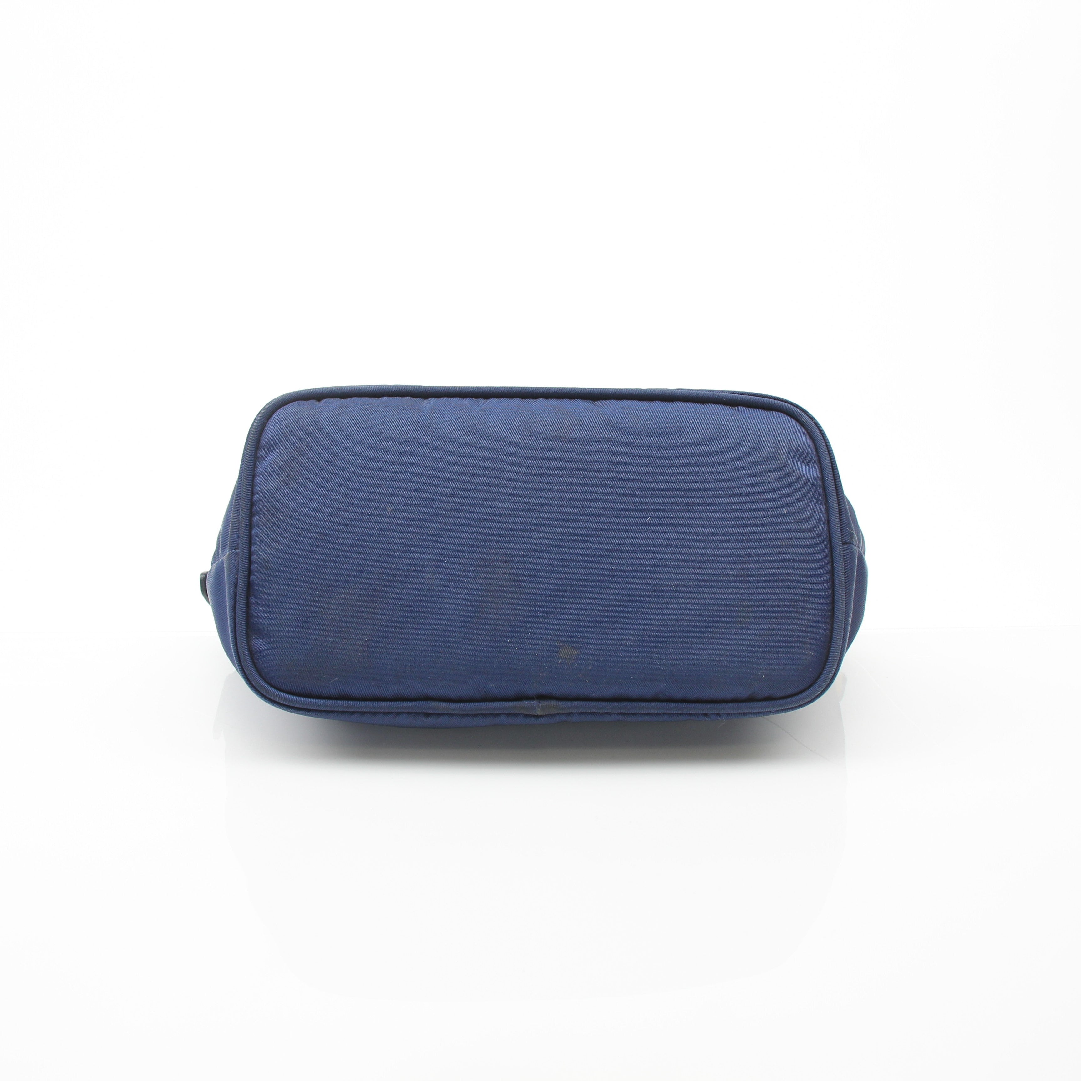 Prada navy blue Re-Nylon cosmetic mini pouch vanity case with gold accents, compact and stylish for travel and organization.