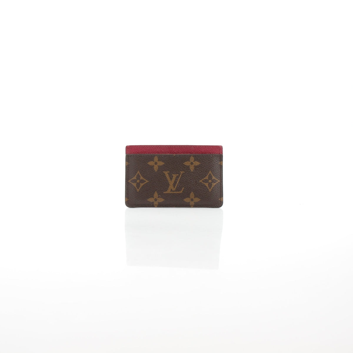 Louis Vuitton Monogram Card Holder in Fuchsia with gold accents, compact leather accessory for cards.