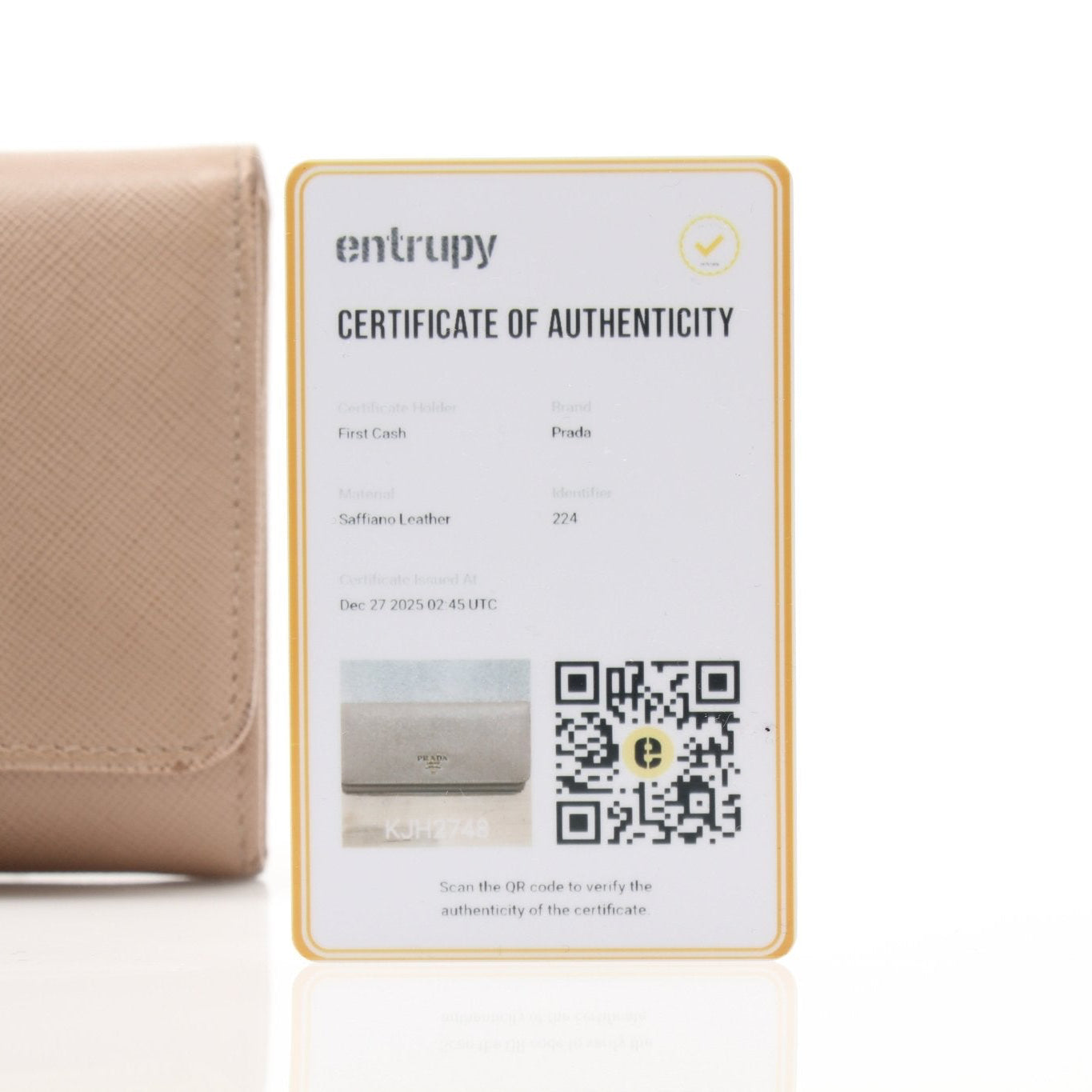 Prada Saffiano Lux beige continental flap wallet with gold hardware, featuring a sleek leather design and multiple card slots.